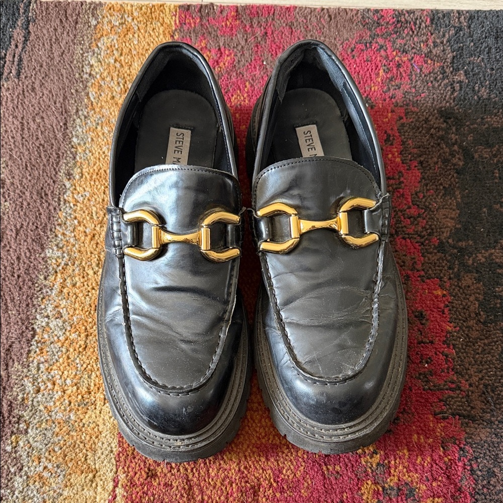 Steve Madden Black Slip-Ons with Gold Detail